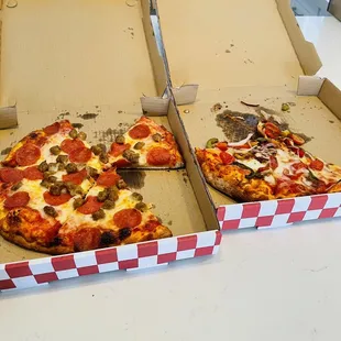 Pepperoni and sausage on one pie and Veggie pizza for the other.