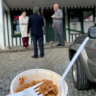 Half eaten half pint of bbq meat