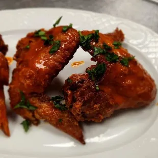 a plate of fried chicken wings