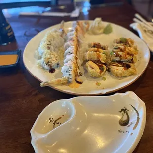a plate of sushi and a bowl of rice