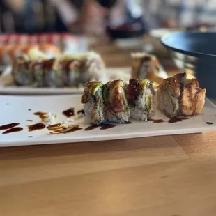 a close up of a plate of sushi