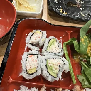 Poorly rolled California roll . No effort to make it good or presentable