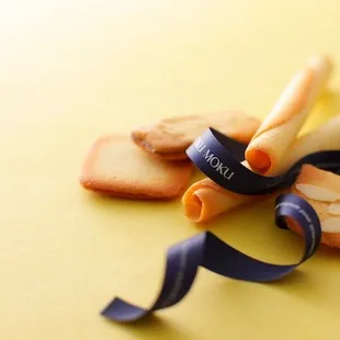  a cookie with a ribbon tied around it