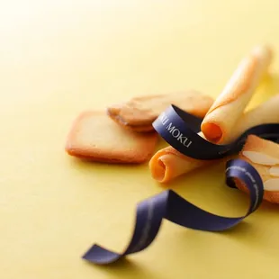  a cookie with a ribbon tied around it