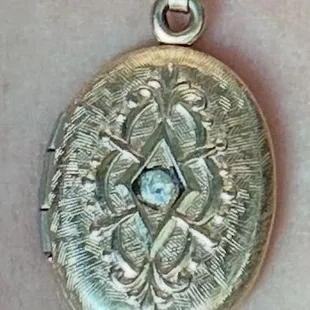 Before- see the black glue around the stone in the center.