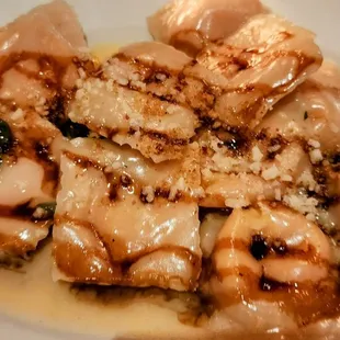 Butternut ravioli with a sage butter sauce drizzled with balsamic vinegar