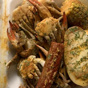 crab legs, potatoes, and corn