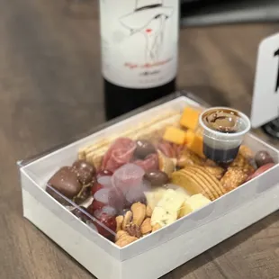 Delicious cracker and cheese platter with olives and chocolate. Our favorite J Welch wine!