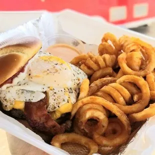 The Rooster - 1/2 lb bacon cheeseburger with a fried egg.  Served with fries and a drink.