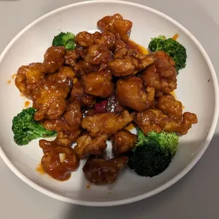 a plate of chicken and broccoli