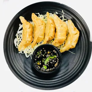 a plate of fried dumplings