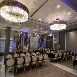 a dining room with chandeliers