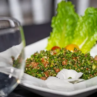 a plate of food and a glass of water