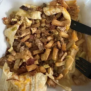 Breakfast burrito with barely any eggs and day old french fries.