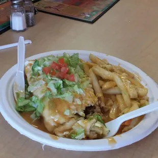 #1 breakfast burrito Jabanero style with cheese fries on the side.