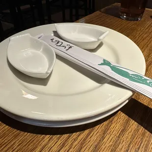 Plates &amp; soy sauce cups with chopsticks