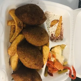 a tray of fried food and fries