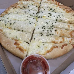 Hay Stacks 12' Round  Garlic herbs and Cheese  With a side of Sauce