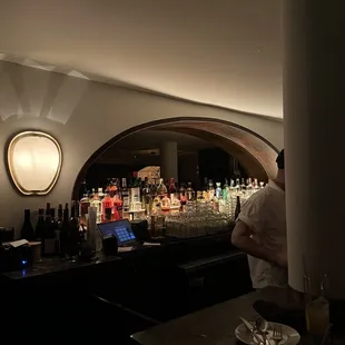 a man behind a bar