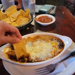 Queso fundido- a layer of beans with cheese and chorizo on top. Seemed more like bean dip but still good!!