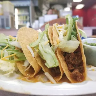 Ground beef tacos $1.50 each, secret is to use the green sauce