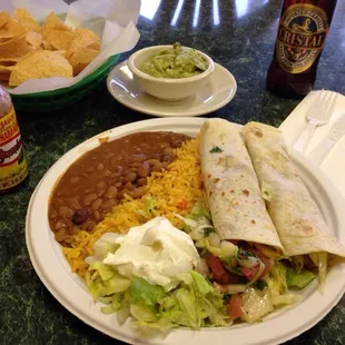 Chicken taco platter with a side of guacamole.