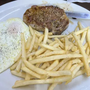 Pork chop breakfast with fries