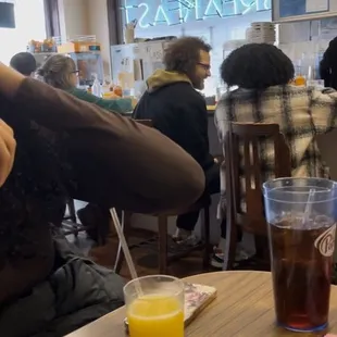 Orange juice smaller than a child size which they charge $3.99