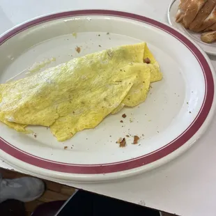 My sister's omelette plate after removing the sliced toast  from the sides