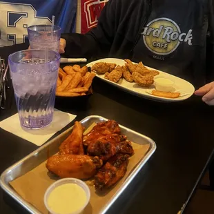 We got Buffalo 6 Bone-in Wings, Boneless Wings with garlic lemon pepper and a basket of fries.