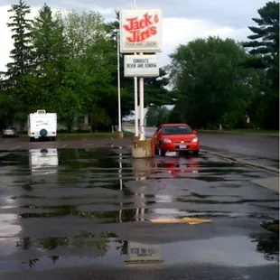 a red car in a parking lot