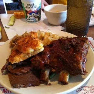 a plate of ribs and sides