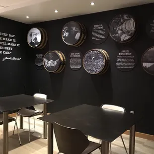 tables and chairs in a black room