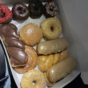 a variety of doughnuts in a box