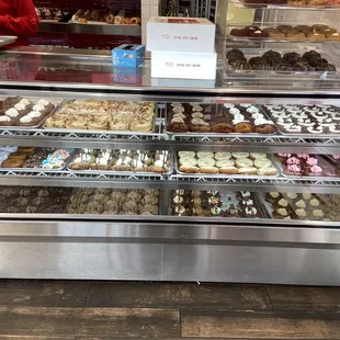 One case of donuts they have another case and a bunch behind the counters.
