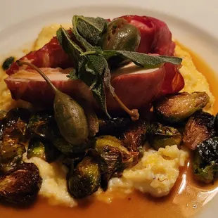 Chicken Saltimbocca -chicken wrapped in prosciutto w/ creamy polenta roasted Brussels sprouts in a lemon-caper berry thyme jus &amp; crispy sage