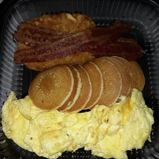 Not bad for $2.99. 3 pieces of bacon, hashbrown, eggs, and pancakes. Nevertheless, napkins, utensils, syrup, hot sauce, ketchup, &amp; cup water