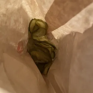 Bag of pickles that should've been a chicken fajita pita.