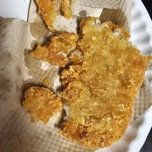 Try to break off the most hard inedible parts and maybe get a bite or two of hashbrown. Also u can see the grease-soaked napkin