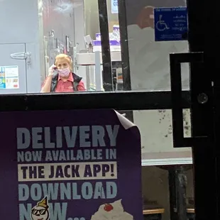 a woman taking a picture of her food