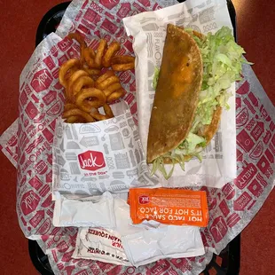 Deep fried taco and curly fries