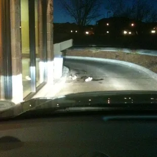 Trash overflowing all over the drive through exit!