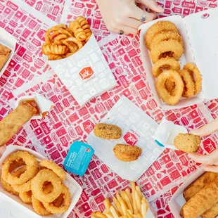 a table full of fried food