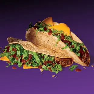 two tacos on a purple background