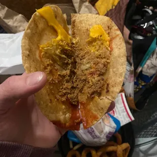 I just open the taco. This is what it looks like there's no lettuce. Wait there's two shreds of lettuce.