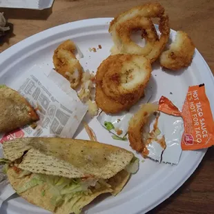 Onion rings were stuck in a block and uncooked. Tacos cold and uncooked.