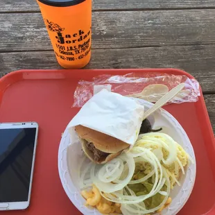 The meal itself. Brisket sandwich with potato salad which tastes homemade, pickles and onions, soda and jalapeno!