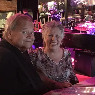  man and a woman sitting at a table