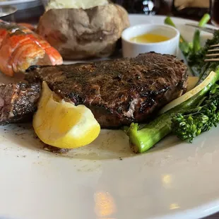 Steak and lobster. Partially eaten when picture was taken.
