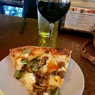 White pizza with ricotta cheese, sausage mushroom bazil and hot honey.. . Must try.